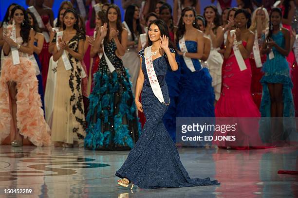 Miss World 2012 winner Yu Wenxia of China waves as she walks to receive the crown during the pageant's final ceremony at the Dongsheng stadium in the...
