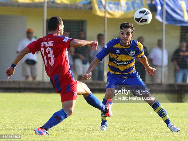 Marco Parolo of FC Parma competes for the ball with Christos Aravidis of Panionios G.S..S during the pre-season friendly match between Parma FC and...