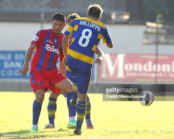 Dimitrios Kolovos of Panionios G.S..S competes for the ball with Daniele Galloppa of FC Parma during the pre-season friendly match between Parma FC...
