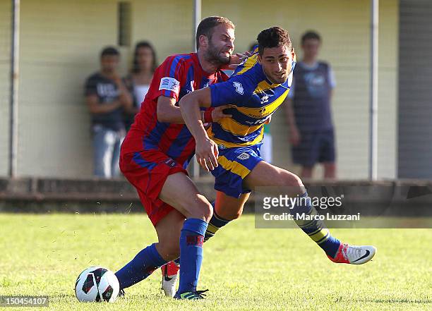 Aleandro Rosi of FC Parma competes for the ball with Efstathios Rokas of Panionios G.S..S during the pre-season friendly match between Parma FC and...