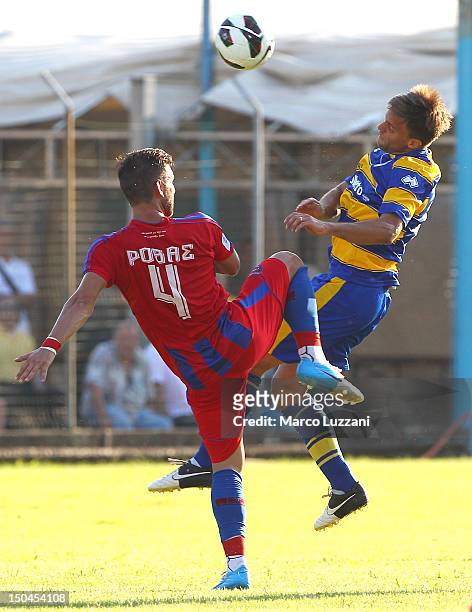 Daniele Galloppa of FC Parma competes for the ball with Vasileisos Rovas of Panionios G.S..S during the pre-season friendly match between Parma FC...