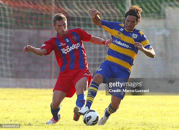 Alessandro Lucarelli of FC Parma competes for the ball with Dimitrios Diamantakos of Panionios G.S..S during the pre-season friendly match between...