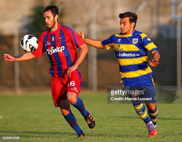 Paraskevas Andralas of Panionios G.S..S competes for the ball with Sotiris Ninis of FC Parma during the pre-season friendly match between Parma FC...