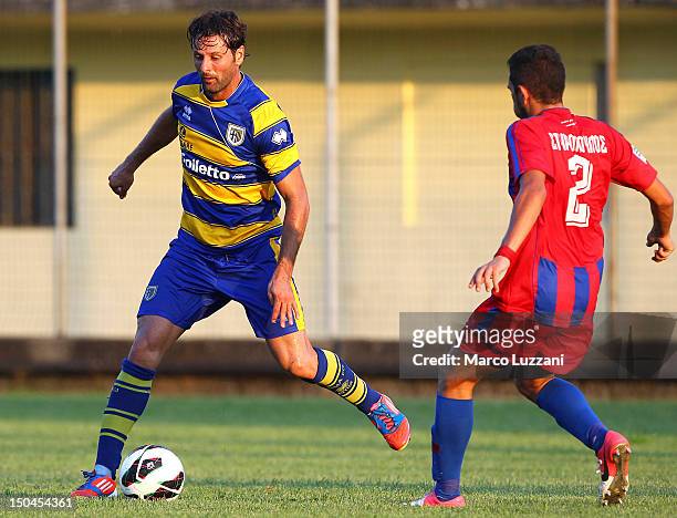 Massimo Gobbi of FC Parma competes for the ball with Panagiotis Spyropoulos of Panionios G.S..S during the pre-season friendly match between Parma FC...