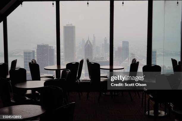 Wildfire smoke obscures the view from the Signature Room on the 95th floor of the former John Hancock Building on North Michigan Ave on June 29, 2023...