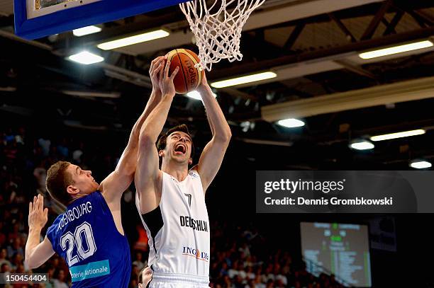 Alexandre Rodenbourg of Luxembourg challenges Philip Zwiener of Germany during the EuroBasket 2013 Qualifier match between Germany and Luxembourg at...