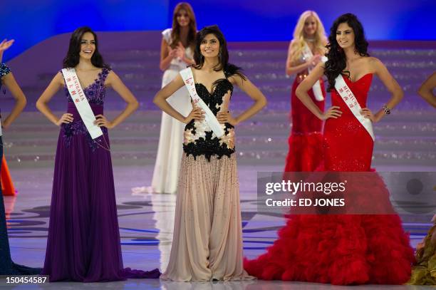 Miss Australia Jessica Kahawaty, Miss India Vanya Mishra and Miss Mexico Mariana Reynoso pose during the Miss World 2012 final ceremony at Dongsheng...