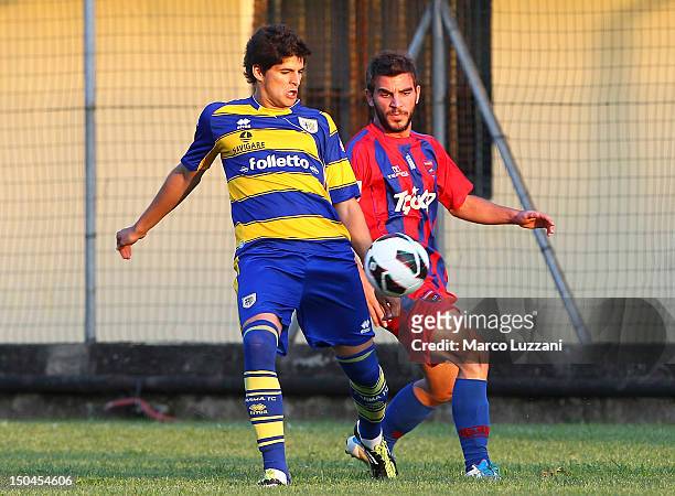 Emilio Maceachen of FC Parma competes for the ball with Markos Dunis of Panionios G.S..S during the pre-season friendly match between Parma FC and...