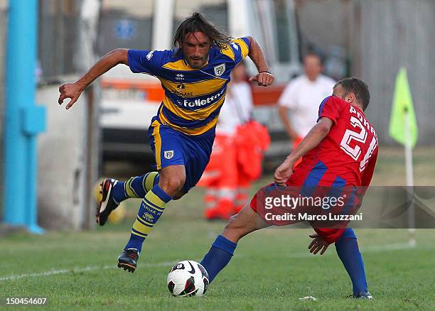 Francesco Modesto of FC Parma competes for the ball with Efstathios Rokas of Panionios G.S..S during the pre-season friendly match between Parma FC...