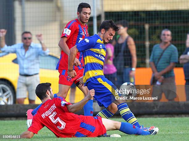 Sotiris Ninis of FC Parma competes for the ball with Anastasios Avlonitis of Panionios G.S..S during the pre-season friendly match between Parma FC...