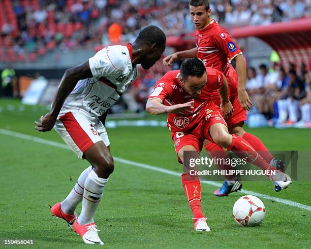 Valenciennes midfielder Gael Danic vies for the ball with Nice's Ivorian forward Franck Dja Djedje during the French L1 football match Valenciennes...