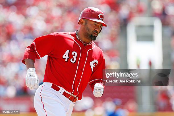 Miguel Cairo of the Cincinnati Reds rounds the bases after hitting a home run in the fourth inning during game one of a doubleheader against the...