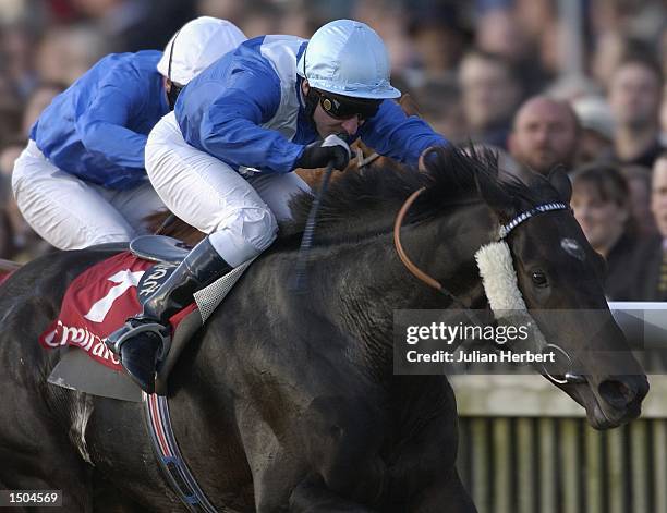 Michael Hills and Storming Home land The Emirates Airline Champion Stakes run at Newmarket Racecourse on October 19, 2002 in Newmarket.