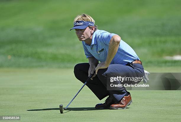 Brad Faxon lines up a putt on the 14th green during the second round of the Dick’s Sporting Goods Open at En-Joie Golf Course on August 18, 2012 in...