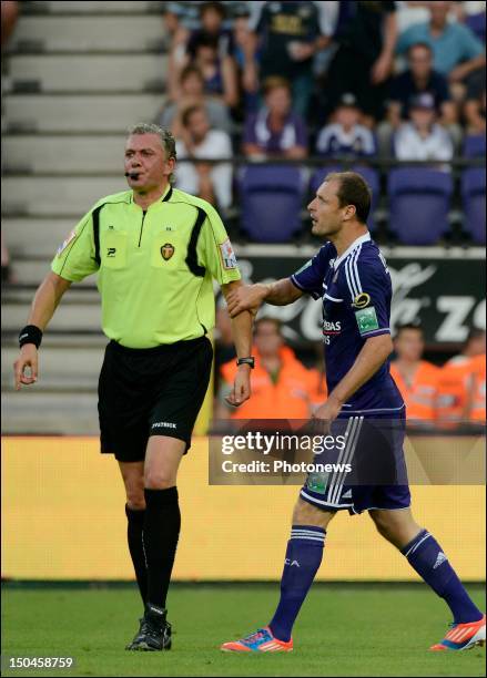 Milan Jovanovic of Anderlecht and referee Joeri Van De Velde in action during the Jupiler Pro league match between RSC Anderlecht and RAEC Mons on...