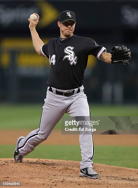 Jake Peavy of the Chicago White Sox warms up against the Kansas City Royals in the first inning at Kauffman Stadium on August 18, 2012 in Kansas...