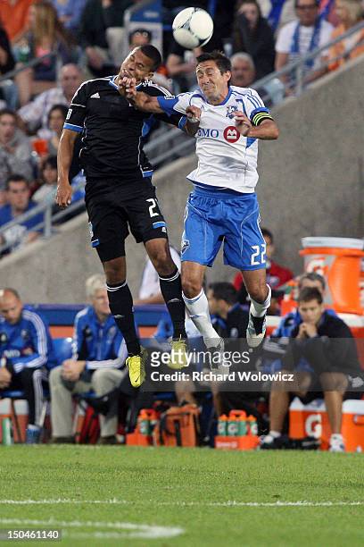 Jason Hernandez of the San Jose Earthquakes and Davy Arnaud of the Montreal Impact jump to head the ball during the match at the Saputo Stadium on...