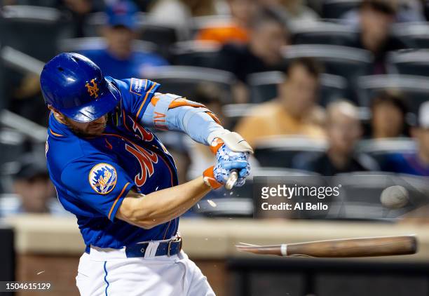 Pete Alonso of the New York Mets breaks his bat hitting the ball against the Milwaukee Brewers during their game at Citi Field on June 28, 2023 in...