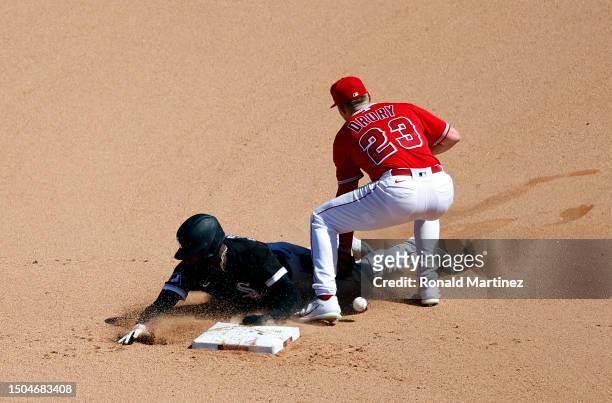 Luis Robert Jr. #88 of the Chicago White Sox steals second base against Brandon Drury of the Los Angeles Angels in the ninth inning at Angel Stadium...