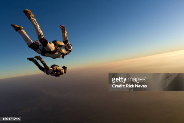 skydiving track sunset - skydive stock pictures, royalty-free photos & images
