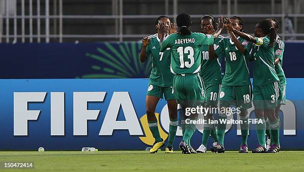 Ngozi Okobi of Nigeria celebrates scoring a goal with team-mates during the FIFA U-20 Women's World Cup Japan 2012, Group B match between Nigeria v...