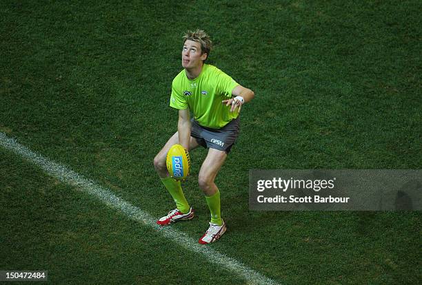Boundary umpire throws the ball into play during the round 21 AFL match between the Hawthorn Hawks and the Gold Coast Suns at the Melbourne Cricket...