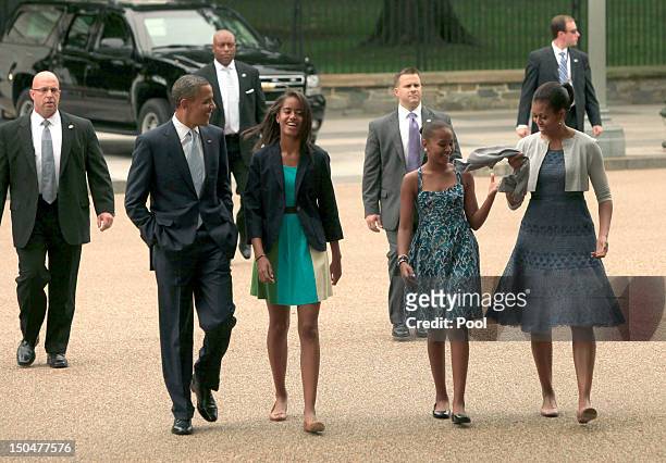 President Barack Obama, Malia Obama, Sasha Obama, and first lady Michelle Obama walk from the White House to St. John's Episcopal Church August 19,...