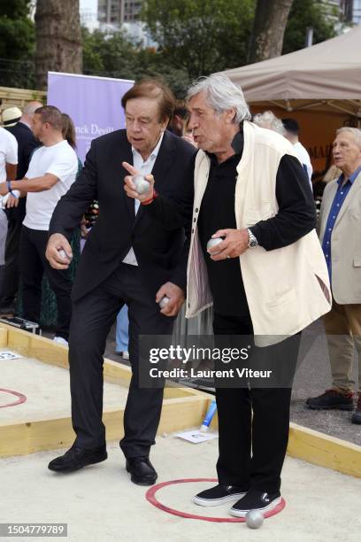 Daniel Lauclair and Jean-Pierre Castaldi attend the Gastronomic Petanque Party on June 29, 2023 in Paris, France.