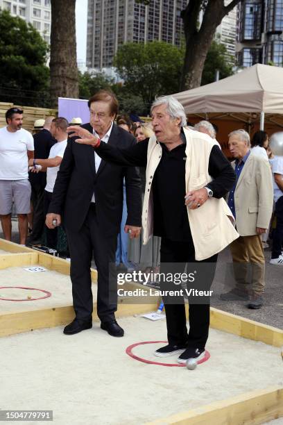 Daniel Lauclair and Jean-Pierre Castaldi attend the Gastronomic Petanque Party on June 29, 2023 in Paris, France.