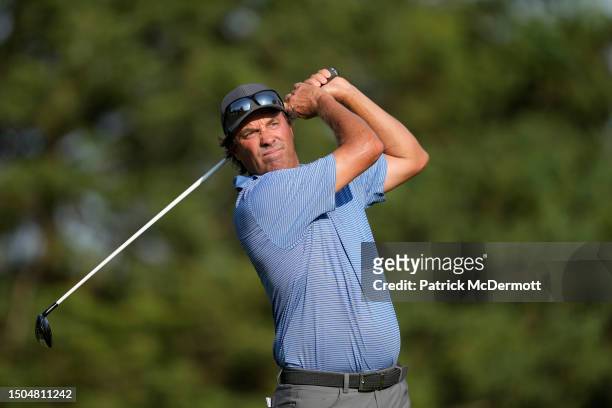 Stephen Ames of the United States plays his tee shot on the 15th hole during the first round of the U.S. Senior Open Championship at SentryWorld on...