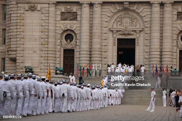 Incoming plebes march into Bancroft Hall after taking part in their Oath of Office Ceremony during Induction Day at the U.S. Naval Academy on June...