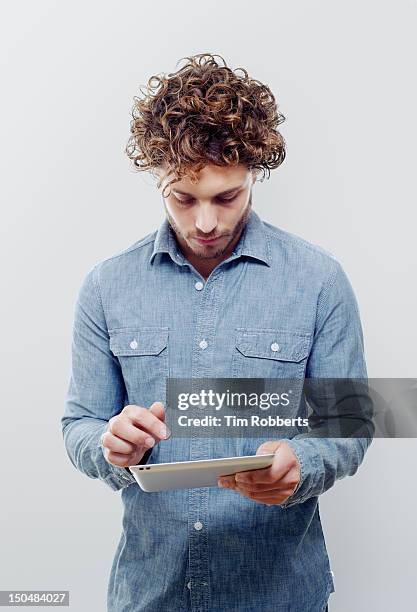 man using digital tablet. - regarder vers le bas photos et images de collection