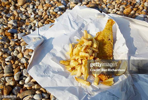 tradional fish n chips on the beach - fish and chips stock pictures, royalty-free photos & images