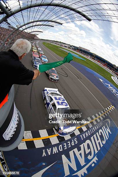 Mark Martin, driver of the Aaron's Dream Machine Toyota, leads the field to the green flag to start the NASCAR Sprint Cup Series Pure Michigan 400 at...