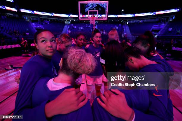 The Minnesota Lynx gather as they listen to the national anthem before the game against the Seattle Storm at Climate Pledge Arena on June 29, 2023 in...