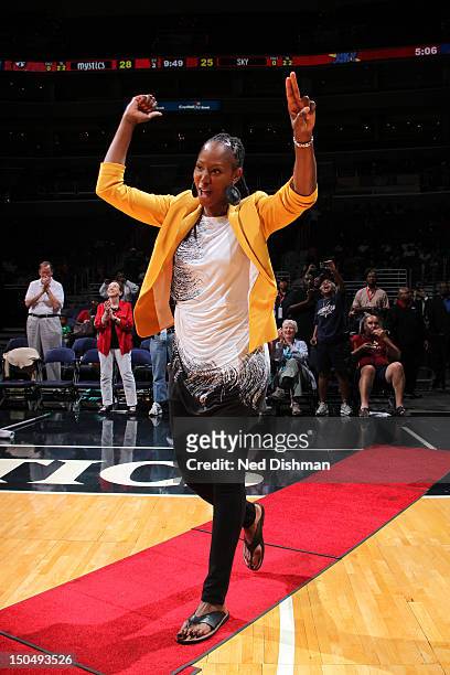 Former Washington Mystic Chamique Holdsclaw waves to the crowd during a presentation of the 15th anniversary all-time team of the Washington Mystics...