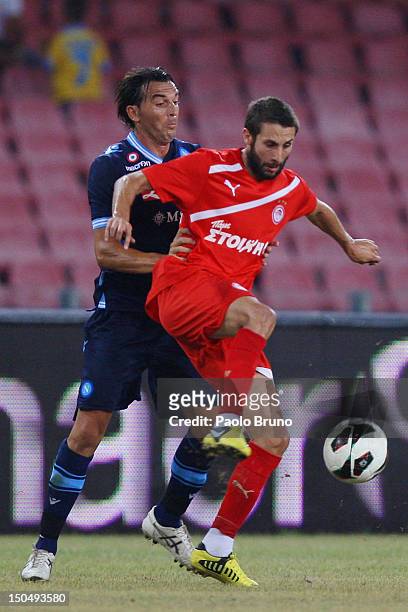 Salvatore Aronica of SSC Napoli competes for the ball with Djamel Abdoun of Olympiacos during the pre-season friendly match between SSC Napoli and...