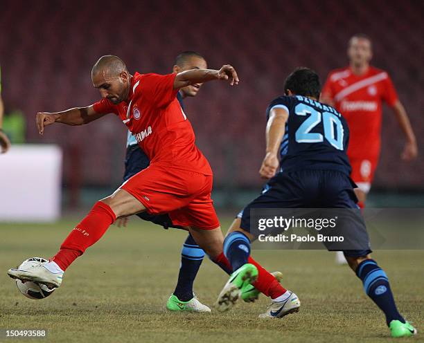 Rafik Zoheir Djebbour of Olympiacos in action against SSC Napoli players during the pre-season friendly match between SSC Napoli and Olympiacos at...