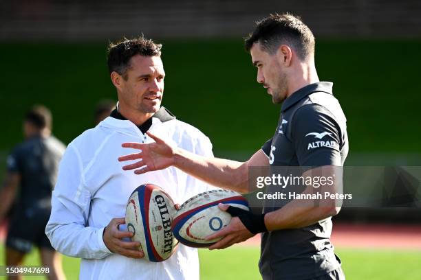 Former All Blacks player Dan Carter runs through drills with Will Jordan of the All Blacks during a New Zealand All Blacks training session at Mt...