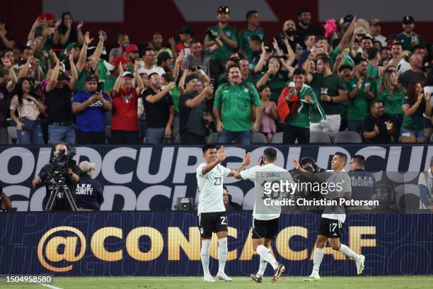 Jesús Gallardo of Mexico celebrates with Luis Chávez and Orbelín Pineda after scoring a goal against the Haiti during the second half of the Concacaf...