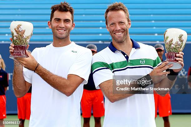Horia Tecau of Romania and Robert Lindstedt of Sweden pose for photographers after defeating Mahesh Bhupathi and Rohan Bopanna of India during the...