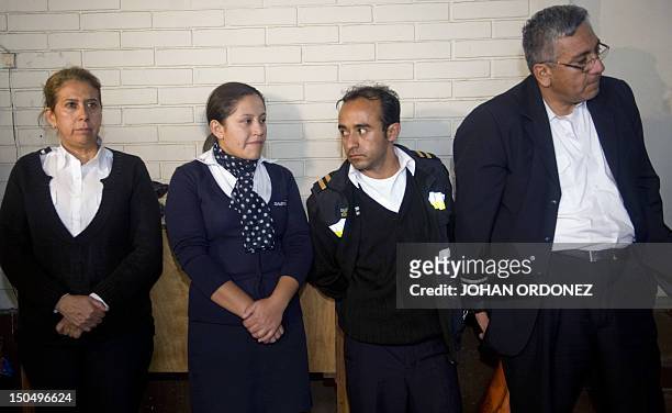 Ecuadorean Eunice Alexandra Ceron Davila, Maria Judith Granizo Salas, Jose Alexander Robelino and Vladimir Lenin Rosero Merido remain standing at a...