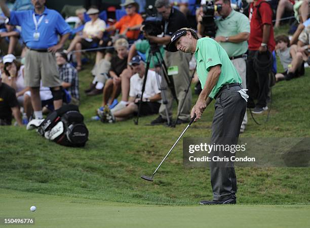 Brad Faxon putts for birdie on the 18th green during the final round of the Dick’s Sporting Goods Open at En-Joie Golf Course on August 19, 2012 in...