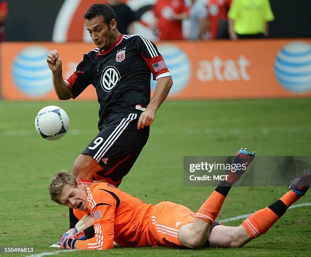 Philadelphia Union goalkeeper Zac MacMath collides with D.C. United forward Hamdi Salihi while going for the ball in the second half at RFK Stadium...