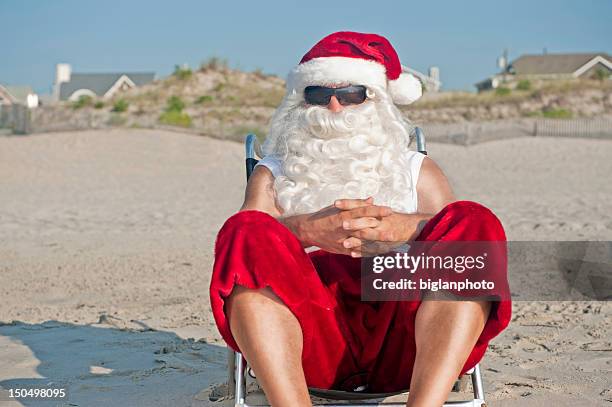 santa claus on vacation - july stock pictures, royalty-free photos & images