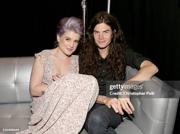 Television personality Kelly Osbourne and chef Matthew Mosshart attend the 2012 Do Something Awards at Barker Hangar on August 19, 2012 in Santa...