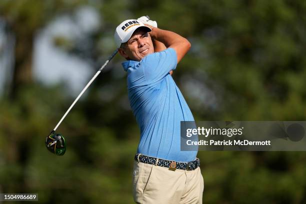 Adilson da Silva of Brazil plays his tee shot on the 15th hole during the first round of the U.S. Senior Open Championship at SentryWorld on June 29,...