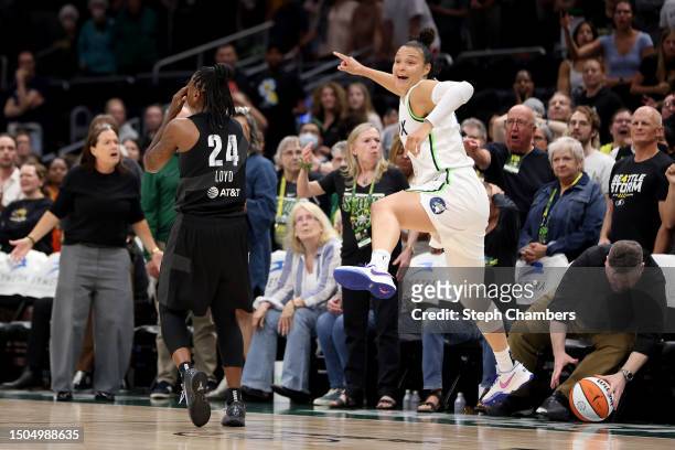 Kayla McBride of the Minnesota Lynx celebrates after Jewell Loyd of the Seattle Storm lost possession of the ball in the final moments of overtime at...
