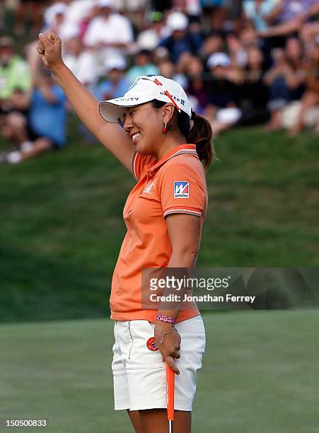 Mika Miyazato of Japan celebrates her win with a par putt on the 18th hole during the final round of the Safeway Classic at Pumpkin Ridge Golf Club...