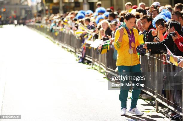 Alicia Coutts signs autographs during the Australian Olympic Team Homecoming Parade in the Sydney CBD on August 20, 2012 in Sydney, Australia.